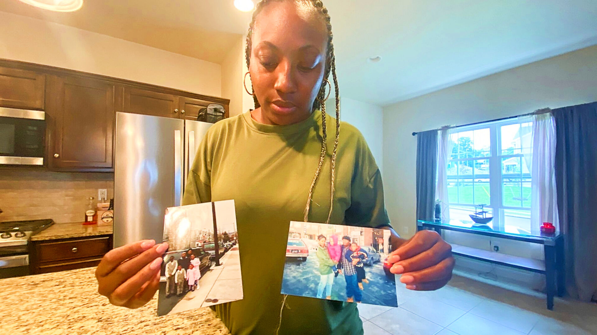 Victoria Gunther with photos of Kerry Frazier